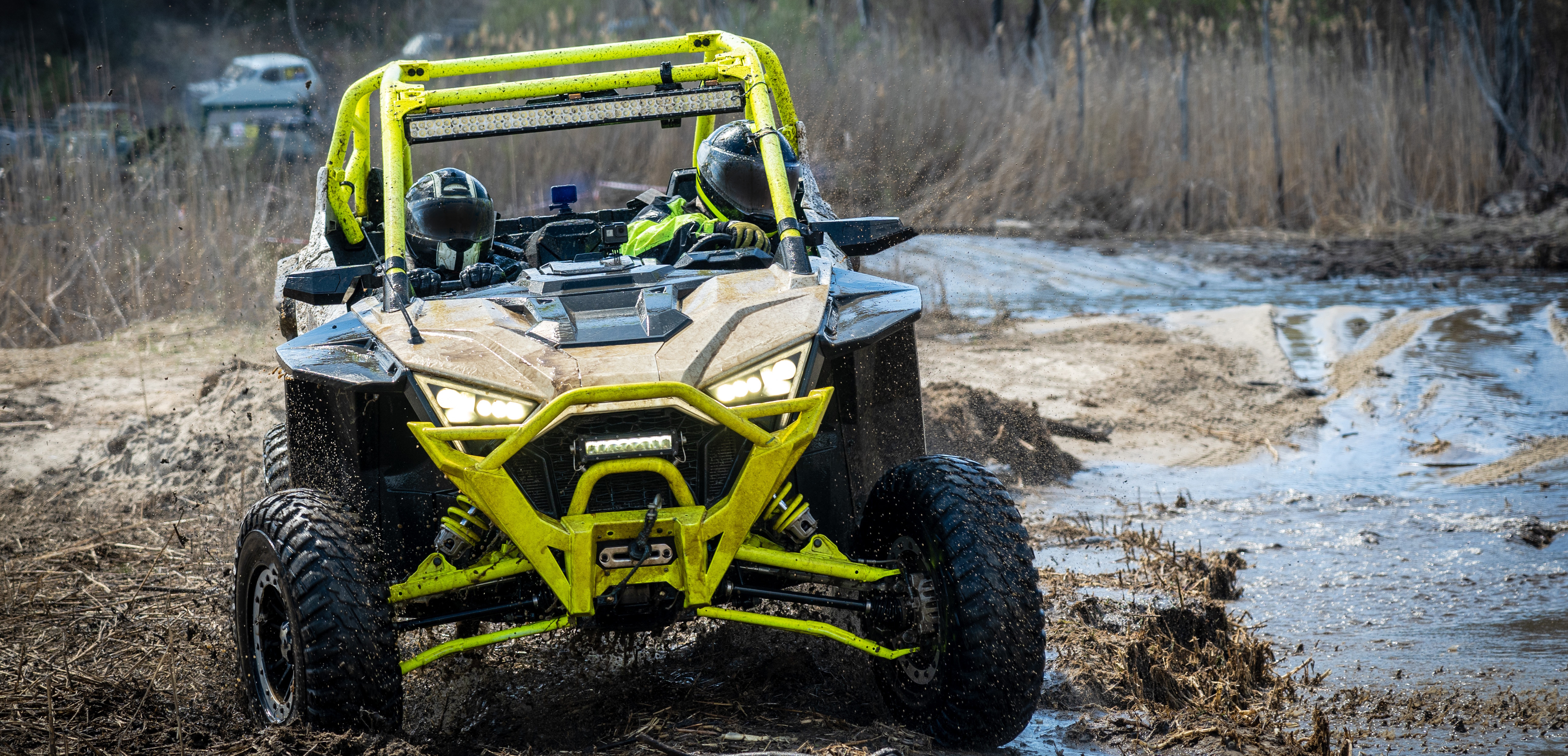 UTV offroad vehicle racing in mud 